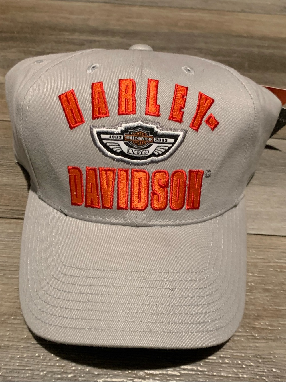 Vintage Harley-Davidson White Cap with Orange and Black Patch